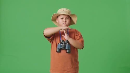 Tourist Boy Researcher Shaking Head Showing Time Out Gesture On The Green Screen