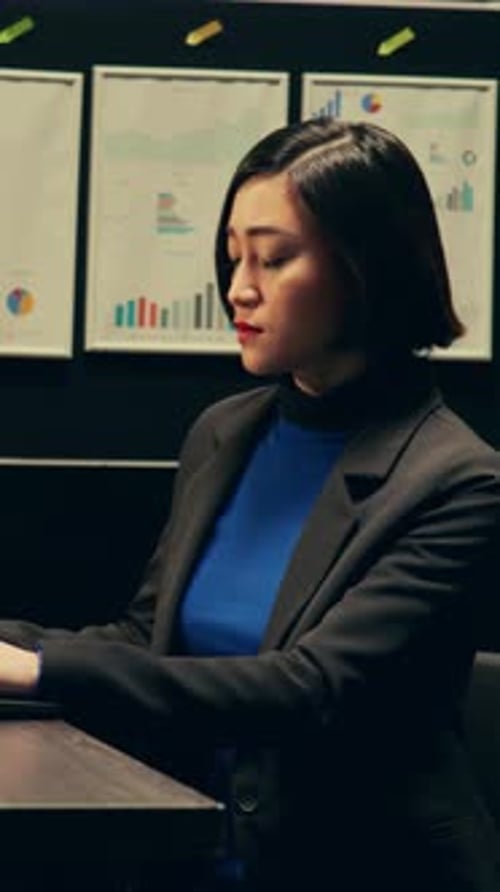 Confident Businesswoman Smiling at Her Office Desk