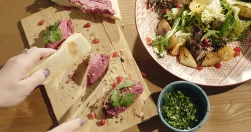 Meal Preparation with Fresh Ingredients and Pita Bread