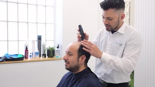 Hair Clinic Technician Performing a Hair Implant Procedure in Slow Motion
