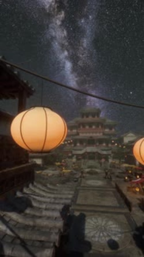 A Group of Lanterns Hanging From a Line Under a Night Sky