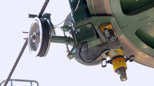 Cable car mechanism spinning wheel of gondola rotating, close up
