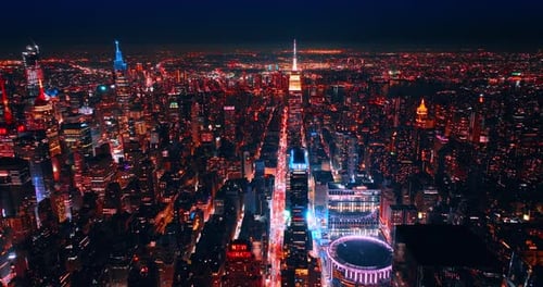 Glowing scenery of amazing New York at night. Flying high above the luminous panorama of metropolis.