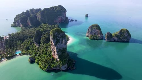 Breathtaking View of Railay Beach in Krabi Thailand with Emerald Waters and Lush Limestone Cliffs