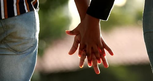 Two people joining hands, African union and support