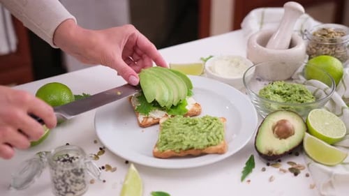 Preparing Tasty Avocado Toast with Lime and Greens
