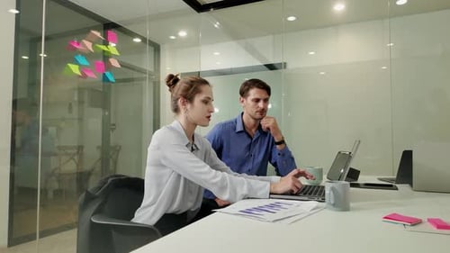 Laptop, collaboration and a manager with a business woman in the office for training or introduction