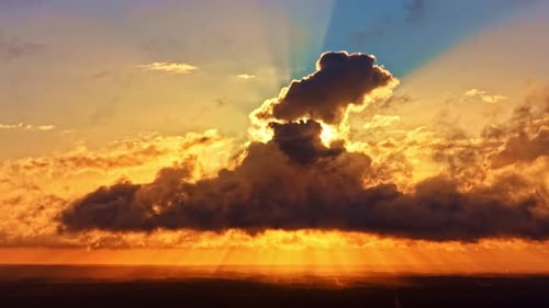 Sunset Rays Through Towering Cloud Formation, Aerial Timelapse
