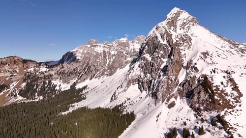 Nature valley mountain snow covered Fronalpstock Glarus Switzerland Swiss Alps aerial