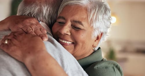 Senior Couple Sharing an Affectionate Embrace at Home