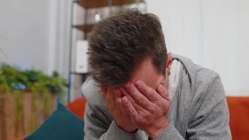 Worried Man with Hands on Head