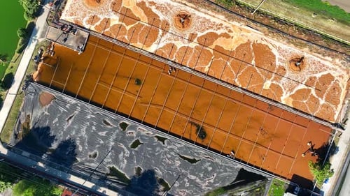 An industrial wastewater treatment pond, aerial view drone.