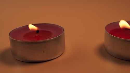 Candles Burning with Melting Wax Close Up