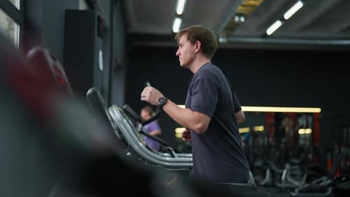 Beginner Sportsman in Activewear Having Intensive Cardio Workout to Burn Calories in Gym Side View