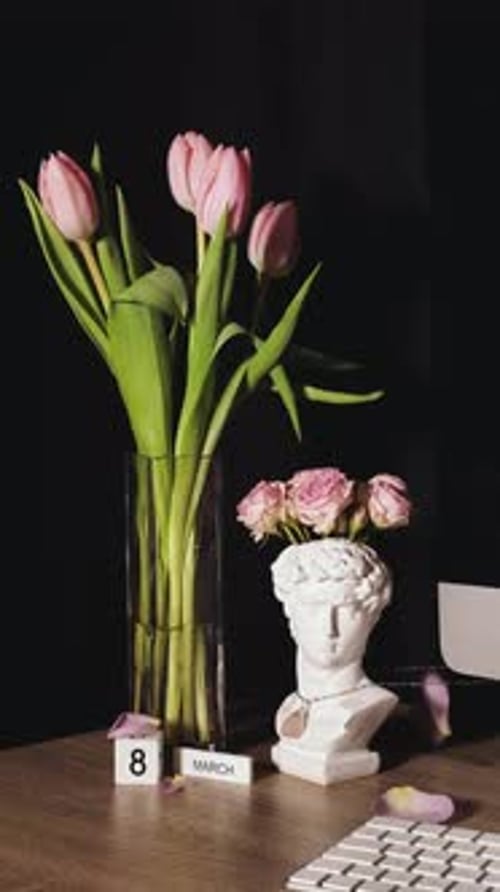 Flowers and Decor on a Desk with Rose Petals