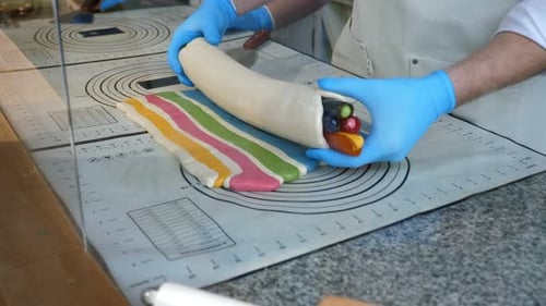 A Pastry Chef Lays Out Rolled Caramel in the Form of Ice Cream in a Pastry Shop