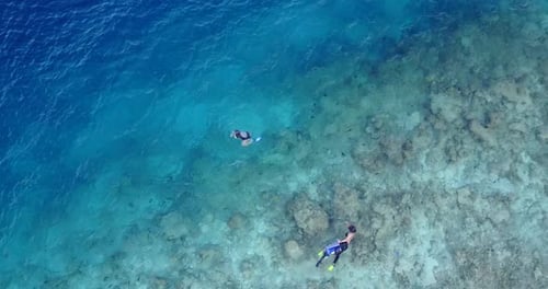 Two Tourist Having Fun in Snorkeling in the Bright Blue Water in Thailand - A Perfect Tourist Desti