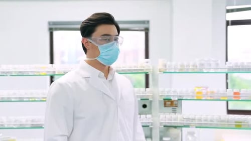 Young Adult Lab Worker with Mask and Glasses