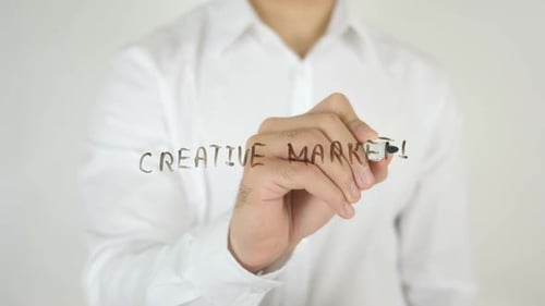 Writing Creative Marketing on Transparent Surface