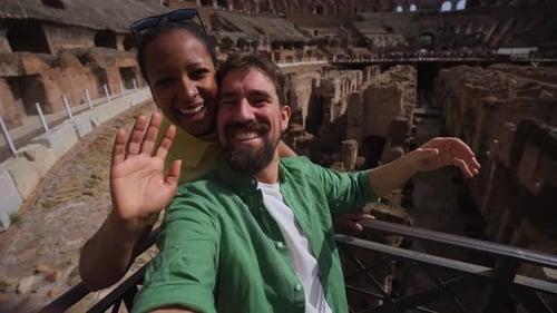 Romantic couple touring Colosseum in Rome Italy