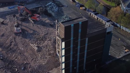Demolished multi storey car park concrete construction site debris in town regeneration aerial view