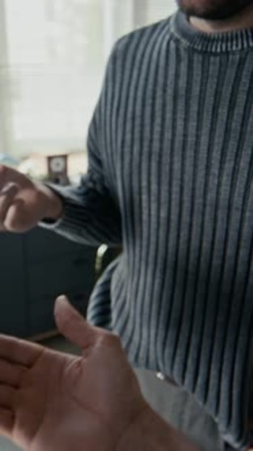 POV of Man Talking to Camera, Discussing Printed Graphs and Charts in Office