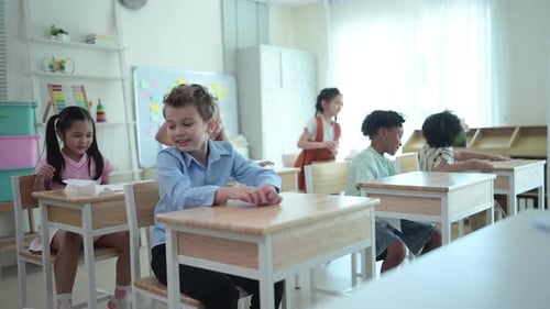 Students learn and study in a classroom of school where youngsters sit and play.