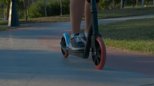 Woman Riding Scooter