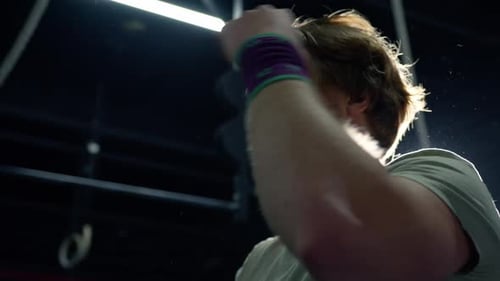 Caucasian man panting after intense exercise in the gym. Slow motion