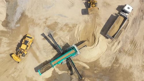 Aerial view loading bulldozer in open air quarry. Sand mining industry. Bulldozer machine. Crawler b
