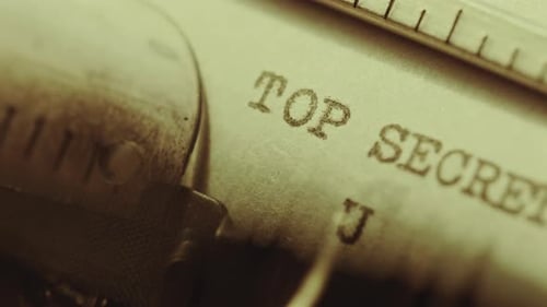 Typewriter Typing Top Secret USA Title on Paper Page