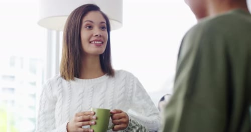 Young Women Chatting and Drinking Coffee at Home
