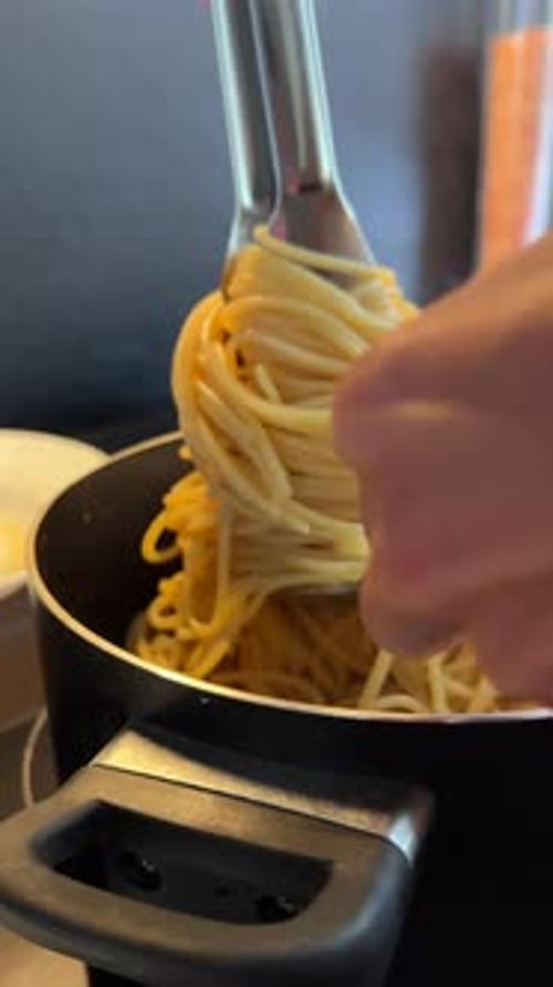 Plating Tasty Spaghetti in a Kitchen