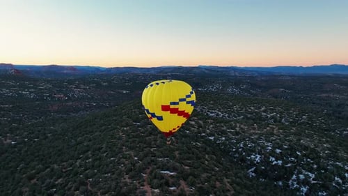 Hot Air Balloon Over Sedona In Arizona, USA At Sunrise. wide aerial