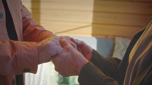Senior Couple Holding Hands in Loving Support
