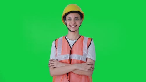 Portrait of Happy Indian female construction worker Green screen