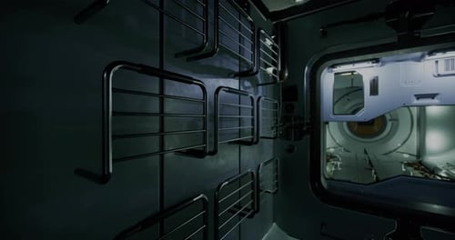 Vue intérieure d'un module d'engin spatial montrant des supports de rangement et un sas