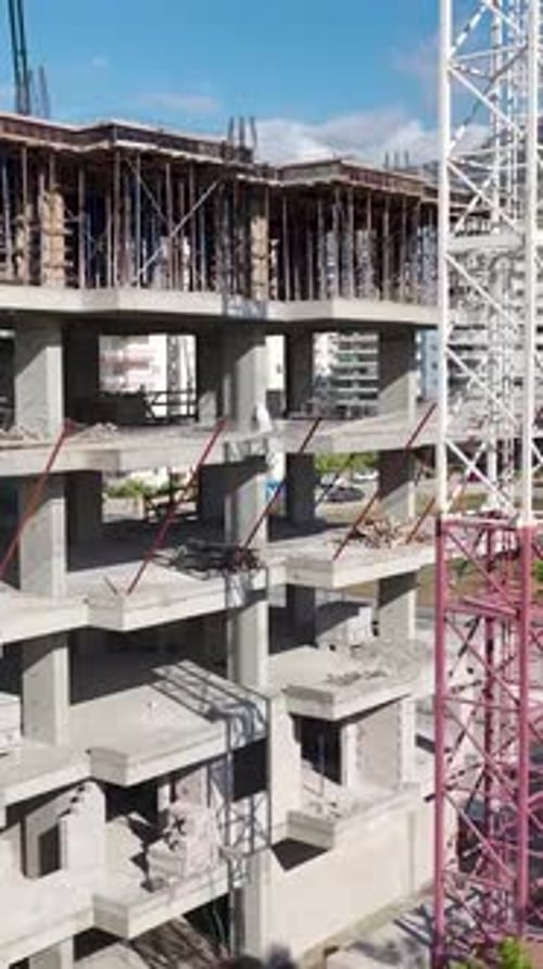 Vertical Video Residential Project Moves Forward with Foundation Pouring By Workers on a Vibrant