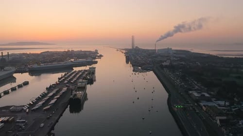 Amazing aerial footage over the River Liffey towards Poolbeg in Dublin City at sunrise.