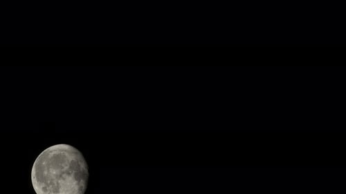 Full Moon Moving Across the Dark Night Sky