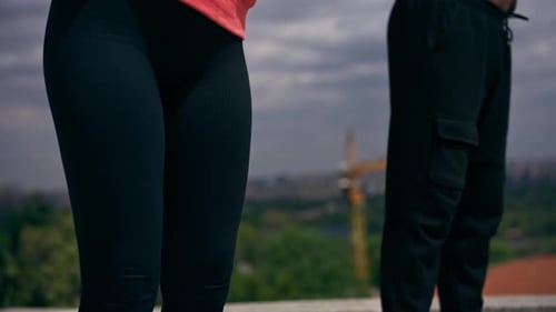 Close Up in the Park a Young Couple in Love Doing Sports Couples Warming Up Healthy Lifestyle