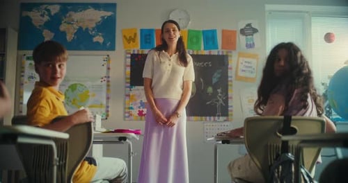 Primary School Girl Showcasing Knowledge of Renewable Energy Resources in Front of Class