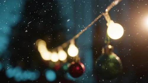 Festive Christmas Ornaments with Falling Snow and Lights