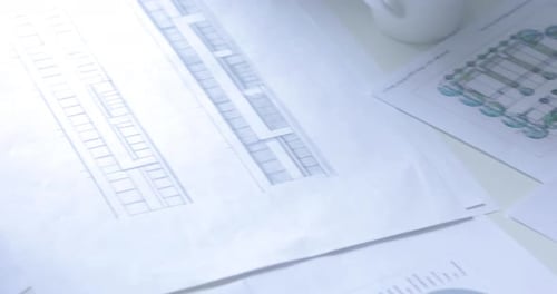 Architect Creating Blueprints and Designs at Work