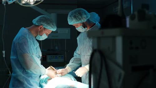 Surgeons Performing an Operation in Hospital Operating Room