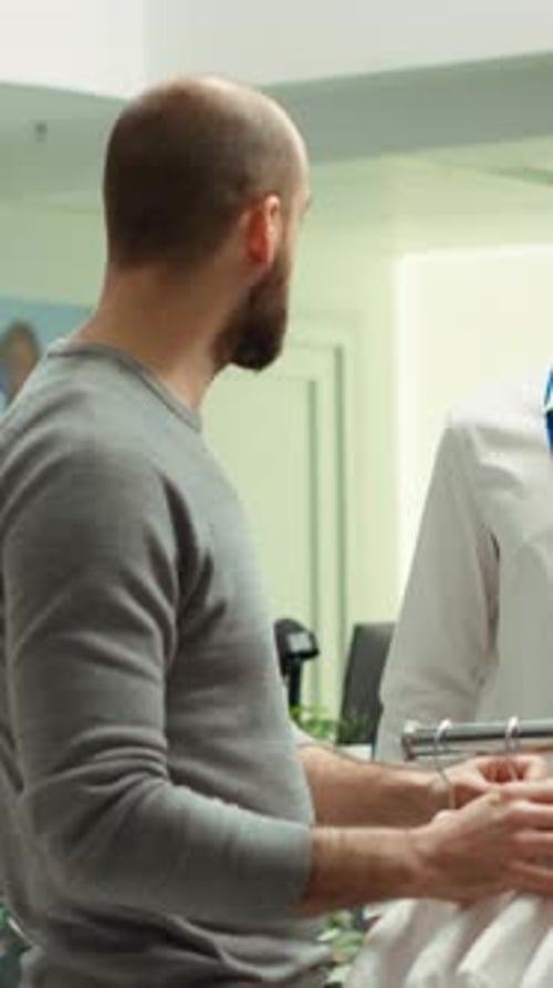 Vertical Video Modern Stylish Store Employee Helping a Client Explore Clothing Options