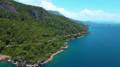 Beautiful view of the beach with boats, pure nature, sea and ships. Shot from a drone