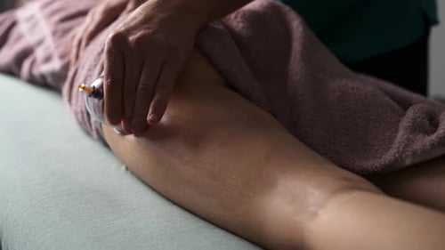 Massage Therapist Doing Back Vacuum Massage With Cups In Spa