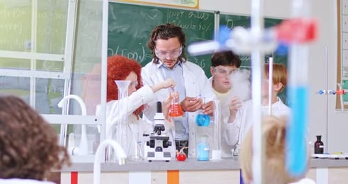 Enthusiastic Science Class Experiment With Teacher