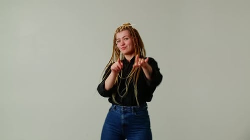 Happy Woman Dancing with Braids